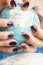 woman hands with purple manicure holding Earth ball, global planet issues concept