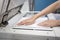 Woman hands putting a sheet of paper