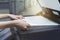 Woman hands putting a sheet of paper into a copying device