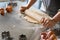 Woman hands rolling dough at home