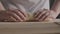 woman hands rolling and kneading dough on kitchen, process of fresh home made organic bread preparation