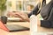 Woman hands rubbing sanitizer gel at homeoffice