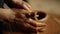 Woman hands sculpting clay product in workshop. Lady modeling pot in studio