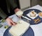 Woman hands serving food rice pudding