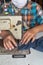 Woman hands sewn fabric repairs on sewing machine in Sewing Process.