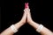 Woman hands showing Anjali hasta or hand gesture of indian classic dance odissi isolated on black background.