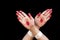 Woman hands showing Swastika hasta or hand gesture of indian classic dance odissi isolated on black background.