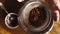 A woman hands sifting cocoa powder into bowl with flour on table. Top view.