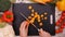 Woman hands slice carrot on chopping board