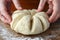 Woman hands split dough