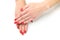 Woman hands, stylish red manicure isolated on background, top view. Healthcare concept