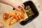 Woman hands throwing food into the trash, bin, waste of food, food concept