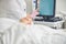 Woman hands touching the screen of a beauty machine