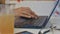 Woman Hands Write Fast on Laptop by Juice Closeup
