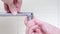 Woman handyman replace tap aerator, hands of a plumber close-up