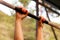 woman hanging on the crossbar for pull-ups