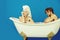Woman and happy man on bathtub, couple in love