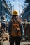 Woman with hard hat standing in front of a ship in ship repair factory. Group of workers on background