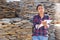 Woman of a hardware store keeps records of natural stone tiles