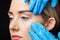 Woman has an examination of her skin before botox injection