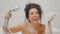 Woman has fun and blows foam in the bathroom in slowmotion