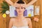 Woman has head massage in indian spa wellness center
