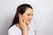 The woman has a sore ear - infection, inflammation from infection and otitis. Perforation ruptured the eardrum. Arthritis of the