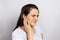 The woman has a sore ear - infection, inflammation from infection and otitis. Perforation ruptured the eardrum. Arthritis of the