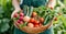 a woman has a wooden bowl filled up with fresh vegetables