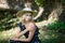 Woman in a hat. In long polka dot dress. Retro italian style