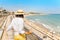 woman in hat looking at the beach in Tarragona, Costa Dorada