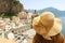 Woman with hat looking at typical italian landscape of Atrani village, Amalfi Coast, Italy