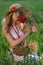 Woman in hat with poppy bouquet