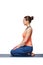 Woman in Hatha yoga asana Vajrasana