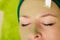 Woman having algae mud mask on face