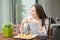 Woman having breakfast on a hotel room balcony