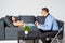 Woman having a conversation with his psychotherapist on couch in office