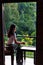 Woman having a cup of tea on the balcony