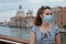 Woman having excursion on Accademia bridge in Venice, Italy