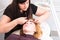 Woman Having Eyebrows Trimmed by Esthetician