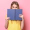 Woman having fun on study process and reading a book.