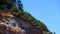 Woman having fun at zipline, sliding from the lighthouse hill