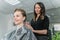 Woman having hair foiled while coloring in hair salon