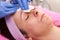 Woman having her face clean in beauty salon