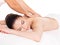 Woman having massage of body in spa salon