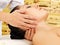 Woman having massage of neck in spa salon