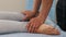 Woman having an osteopathic treatment - massagist massaging her feet