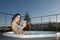 Woman having relax in jacuzzi under blue sky