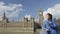 Woman Having Smoothie On Westminster Bridge in London England