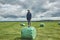 Woman on a hay bales in a field